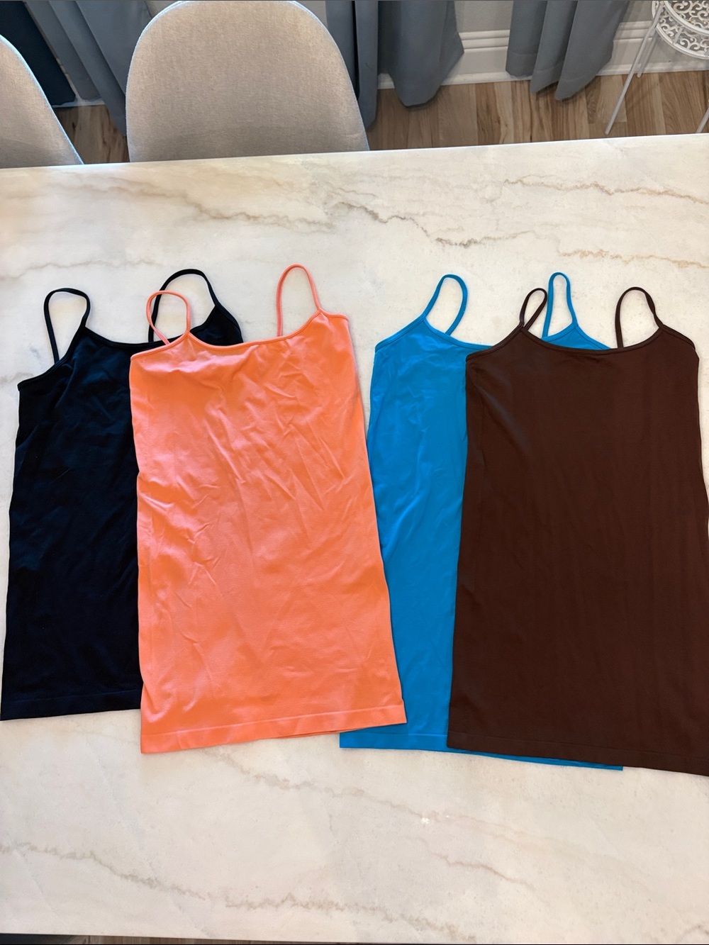 Lot of lightweight stretchy spaghetti straps camisole tops.